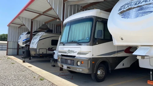 Close up of RVs and boats in covered storage